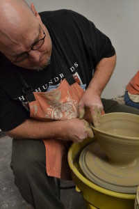Missouri State University ceramics professor, Kevin Hughes, throwing a basic bowl in the University's studio on Tuesday, March 23rd.